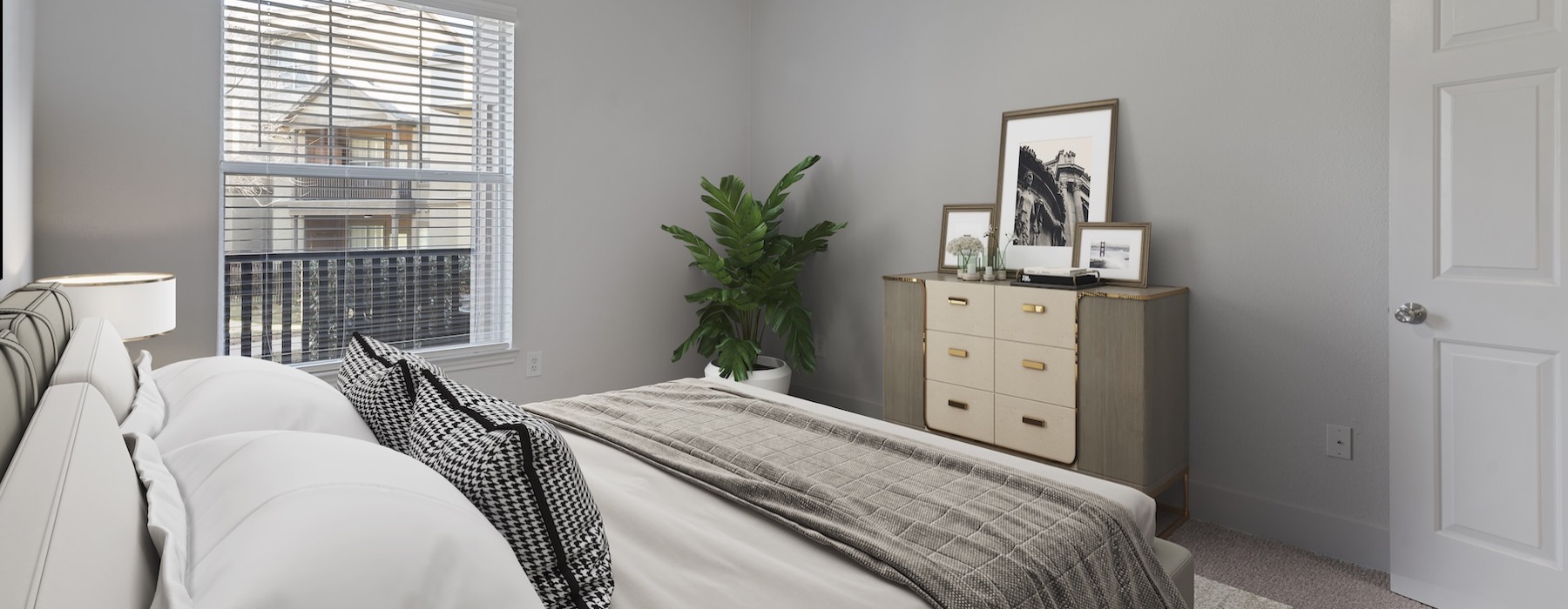 a bedroom with a fan and a bed