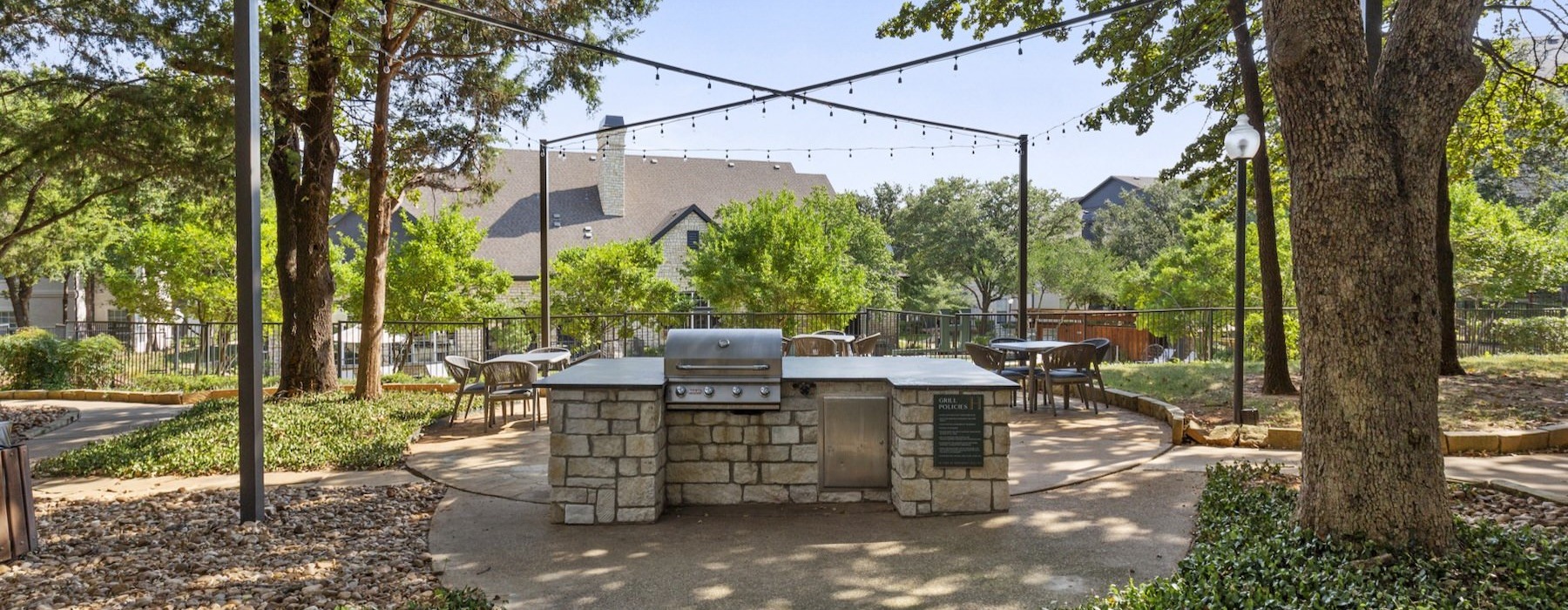 a courtyard with a grill